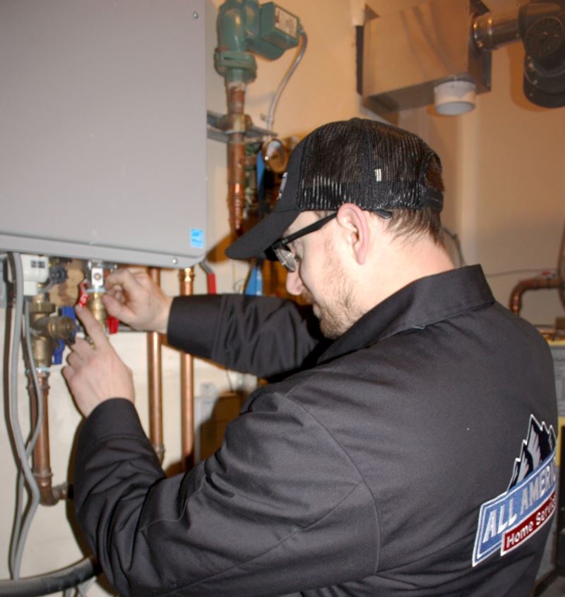 Plumbing technician fixing water heater