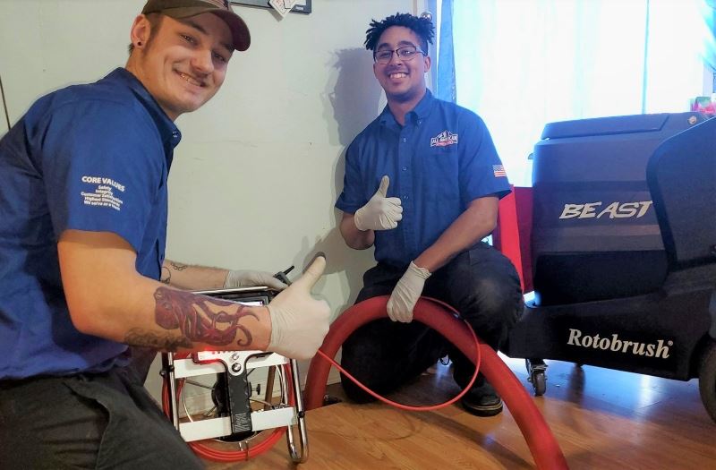 Plumbing Technicians performing duct cleaning